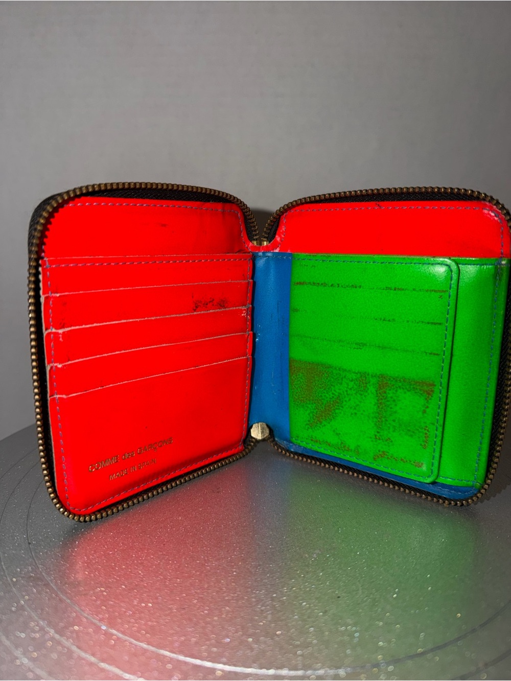 Comme De Garçons full zip neon wallet
As-Is